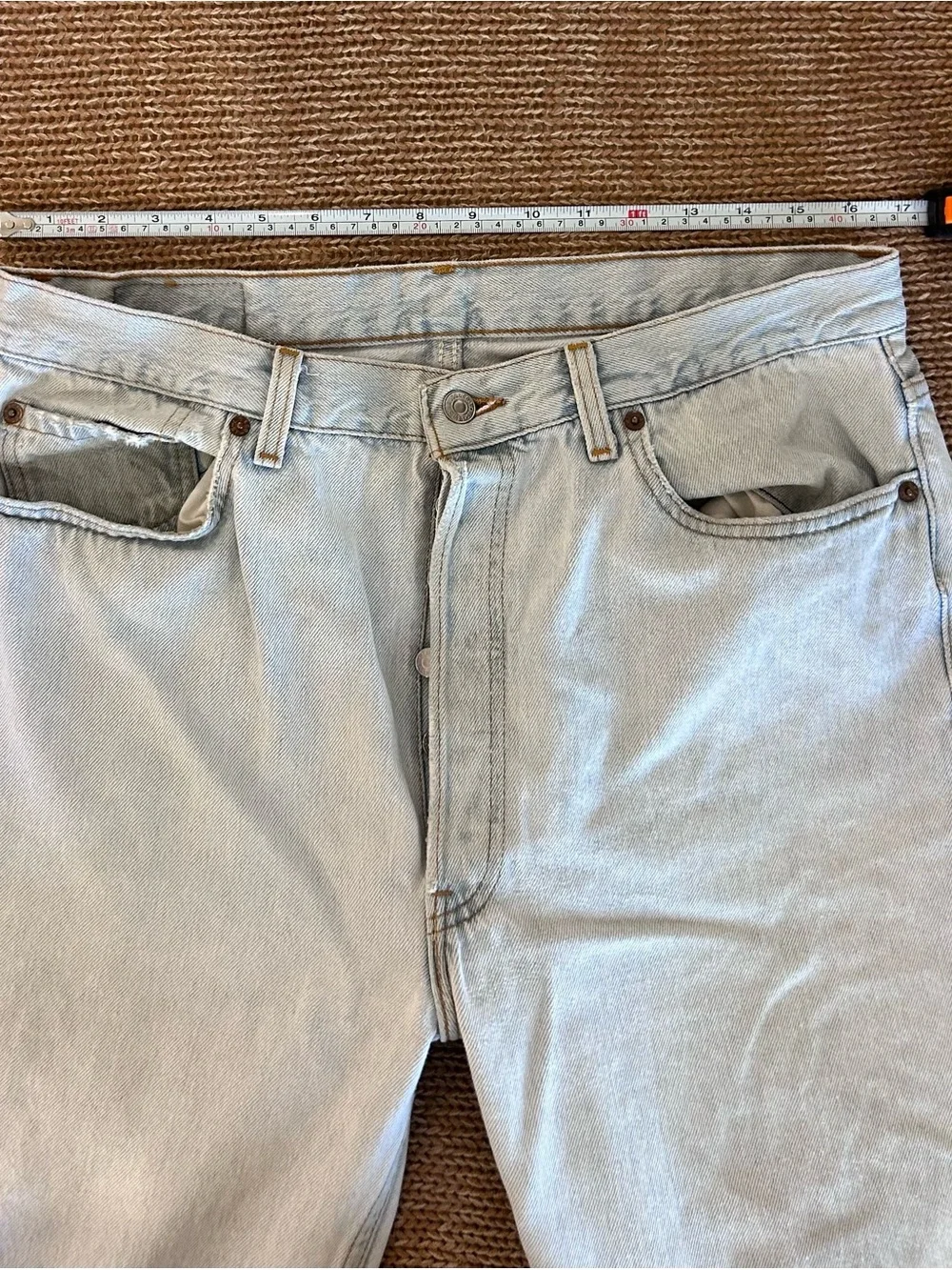 Vintage 1993 men's Levi's 501 light blue denim jeans with leather patch 38×34